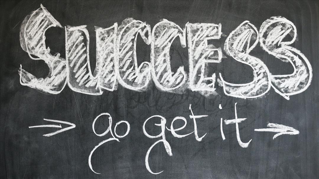 Blackboard with "success go get it" written on it