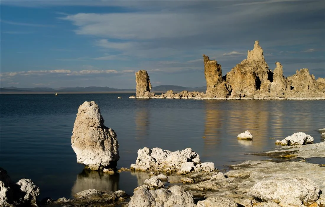 Rocks in dreamy still water at Mono Lake California
